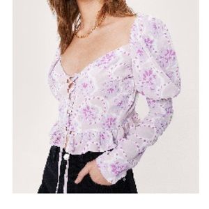 Floral puff sleeve lace up blouse.